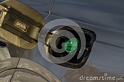 Ð¡losed green fuel cap with the inscription `Diesel`. Stock Photo